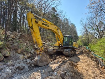 Backhoe digging a trench 3/27/2026